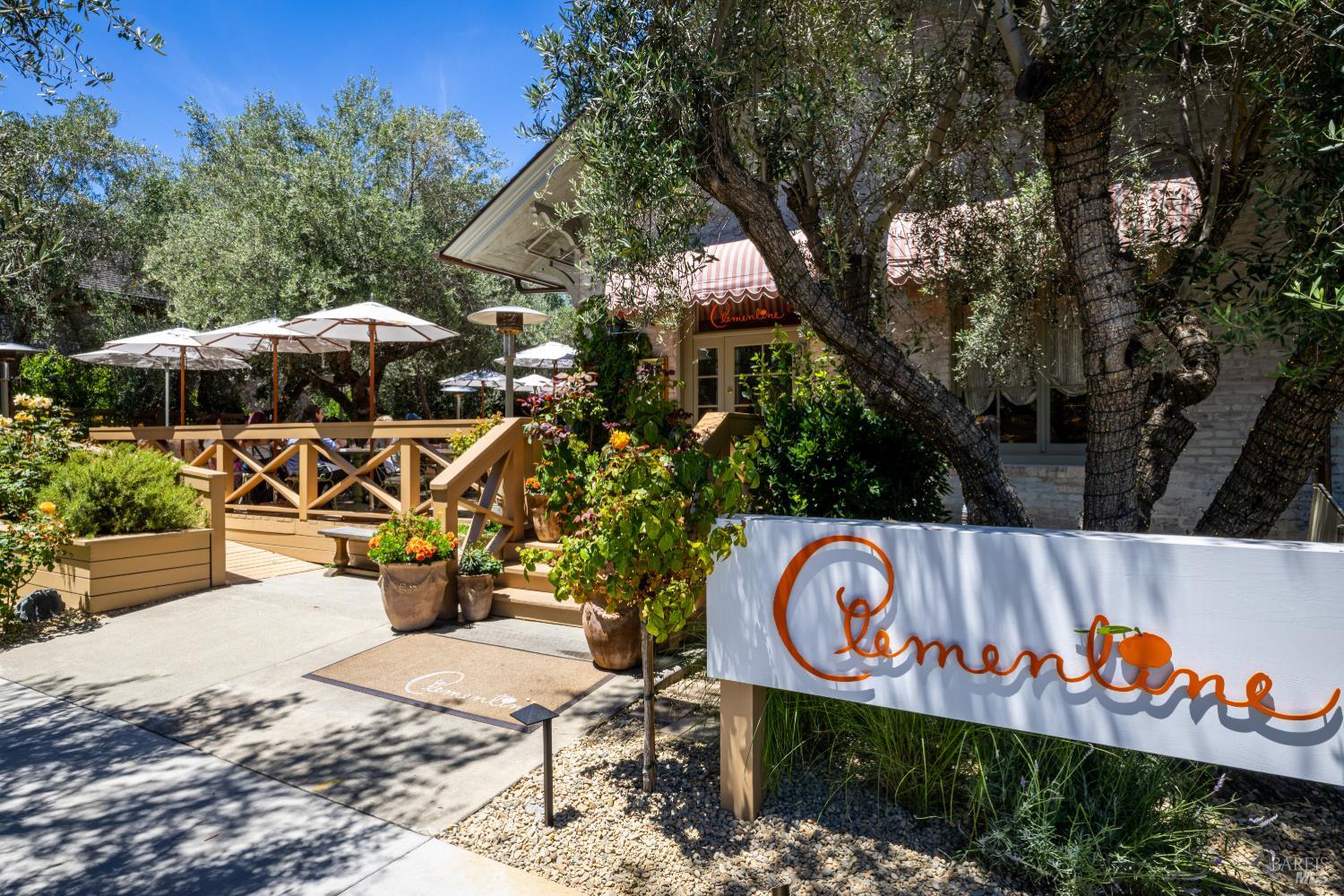 Clementine restaurant patio shaded by olive trees in Yountville